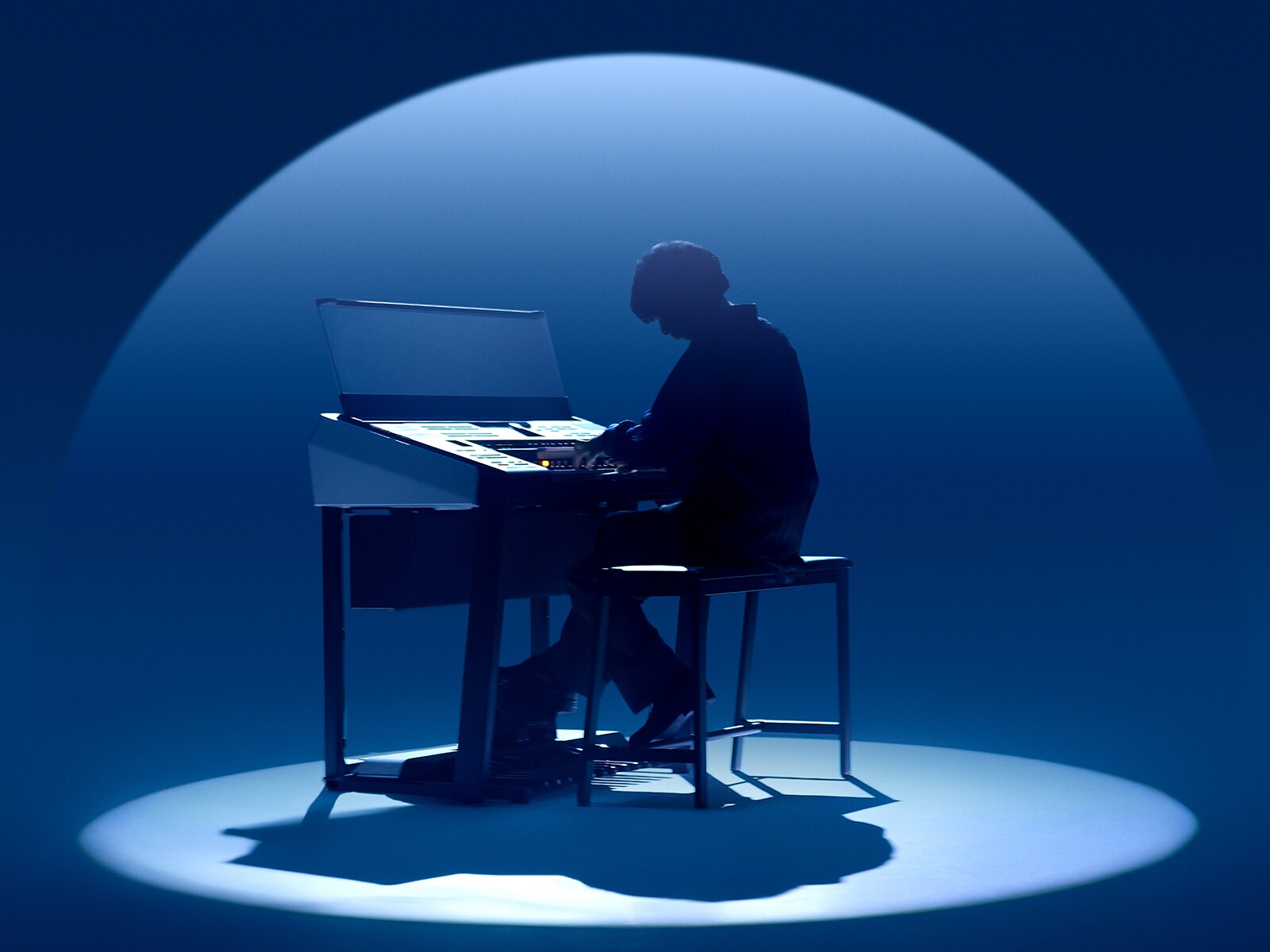 Performer immersed in sound during a performance.