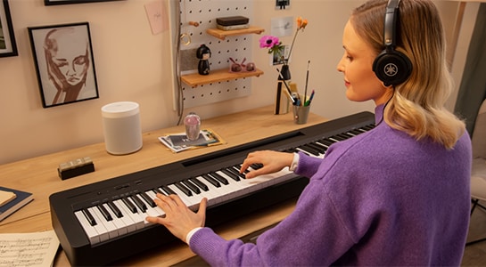 Girl’s playing Yamaha P-145 88-key digital piano