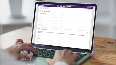 Photo of a person managing devices on a PC, showing integration with common IT management tools