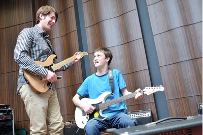 Group music lesson with students participating in an activity