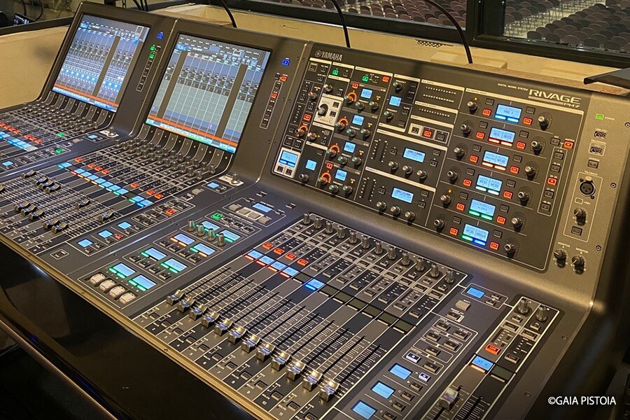 Yamaha RIVAGE PM series digital mixing console installed at Allianz MiCo, overlooking a conference hall as part of the venue’s integrated audio control system.